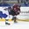 POPRAD, SLOVAKIA - APRIL 15: Latvia's Emils Gegeris #20 takes a shot past Slovakia's Martin Fehervary #6 during preliminary round action at the 2017 IIHF Ice Hockey U18 World Championship. (Photo by Andrea Cardin/HHOF-IIHF Images)